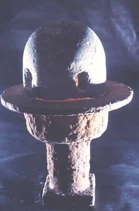 N.T. - 1998 - bluestone, iron, light - height 52 cm, Ø 38 cm